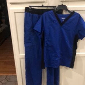 1 pair Electric Blue Scrubstar uniform. Shirt is large, pants are medium